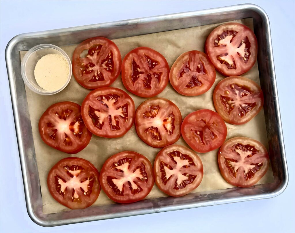 Seasoned Tomato Slices on baking sheet.