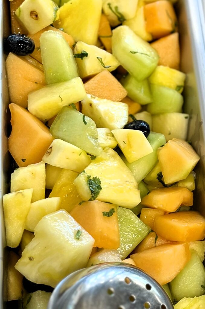 Honey Mint Citrus Dressing on Fruit Salad.