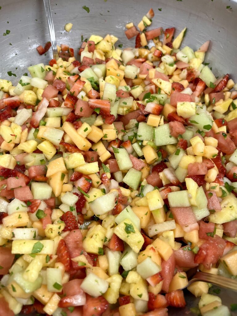 Honey Mint Citrus Dressing on Fruit Salad.