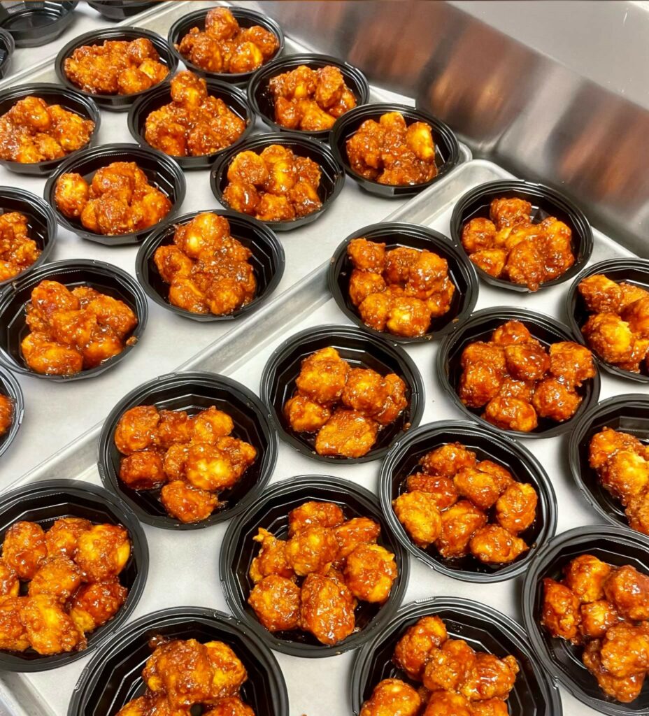 Honey-BBQ Boneless Wings in cups.