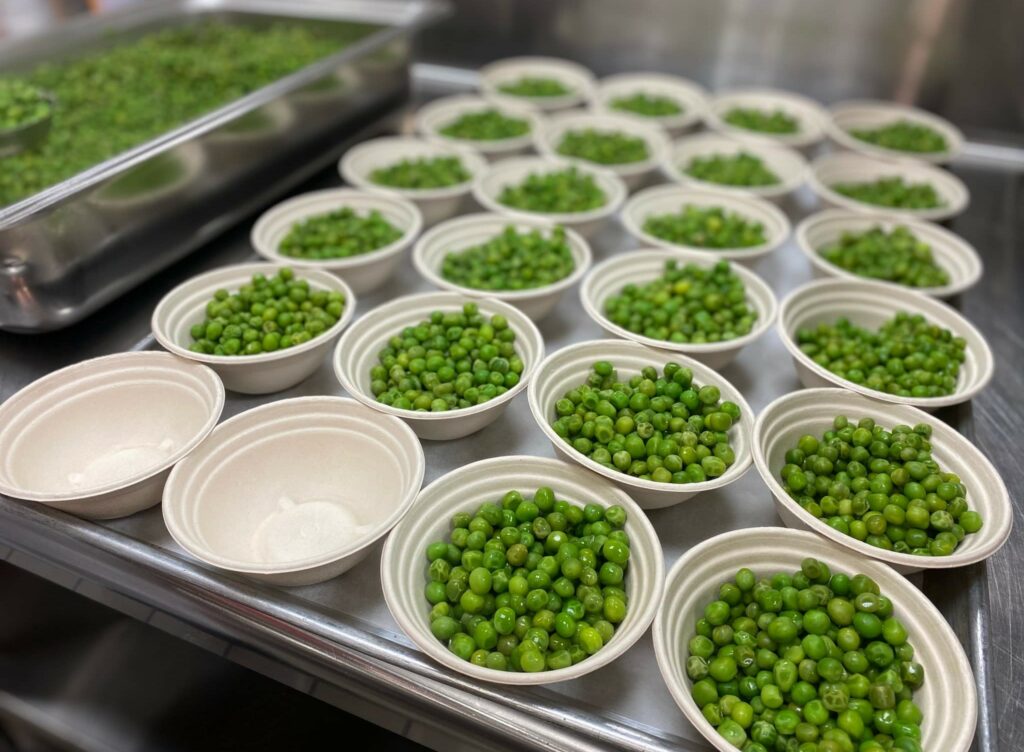 Steamed Peas portioned for serving.