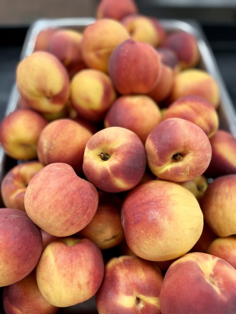 Peaches in 4-inch skinny pans for service.