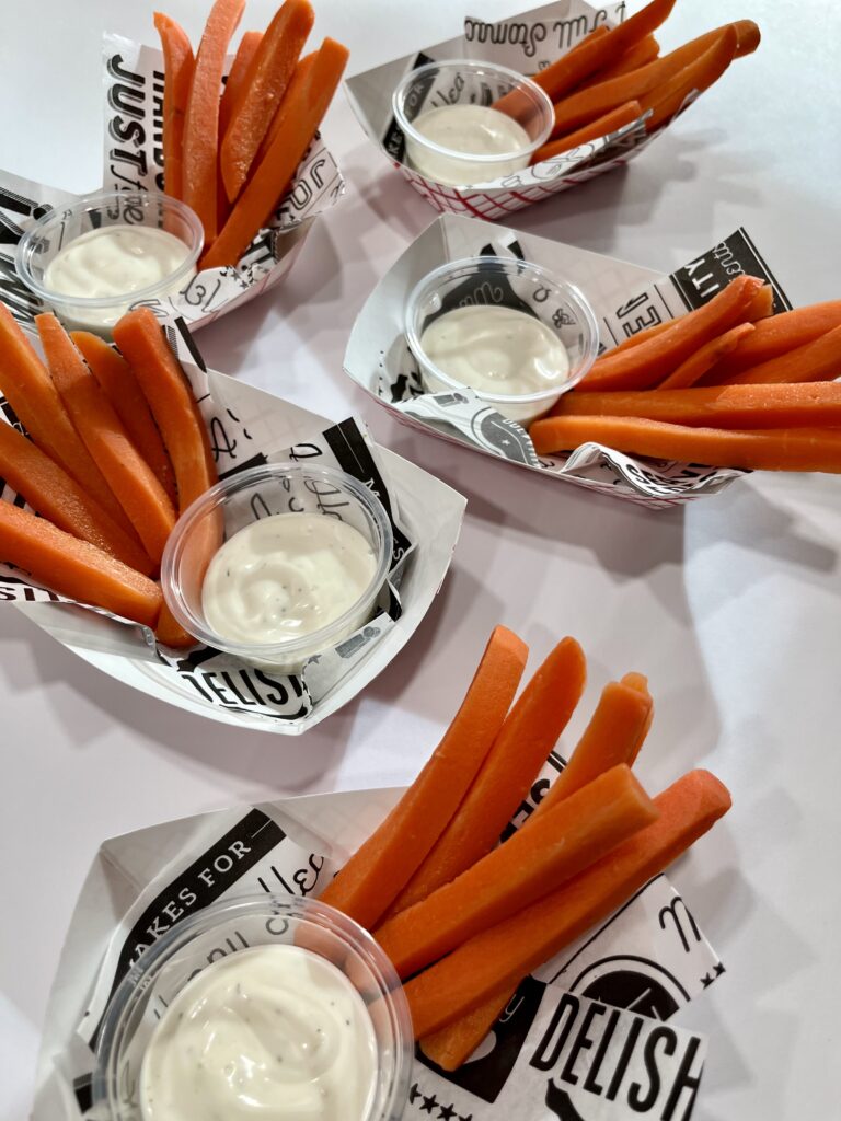 Carrot Dippers with ranch dressing in baskets.