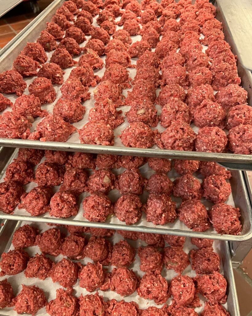 Italian Beef Meatballs on baking sheets prior to baking.