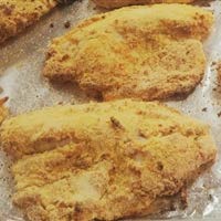 Oven Fried Tilapia on a pan.