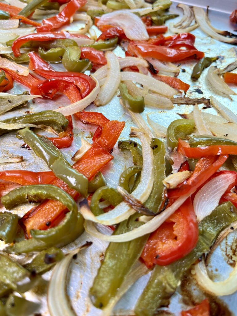 Slow Roasted Onions and Peppers on baking sheet.