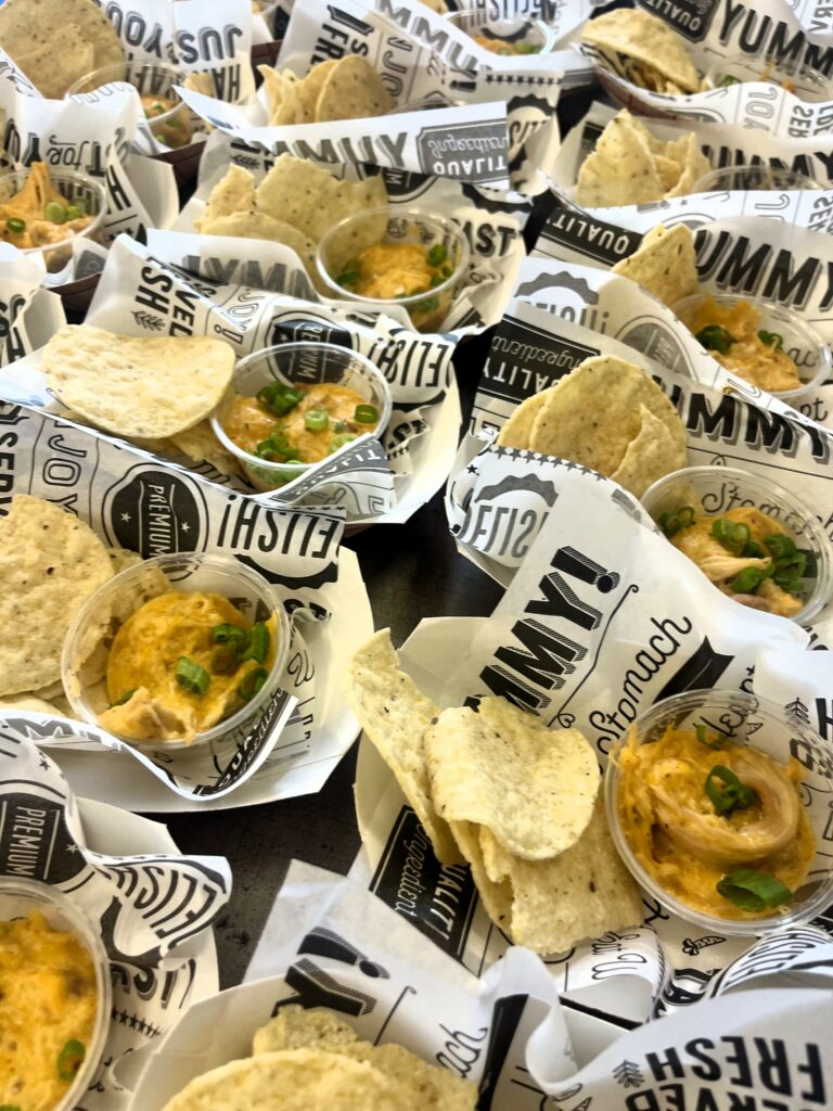 Smoked Buffalo Chicken Dip with chips in baskets.