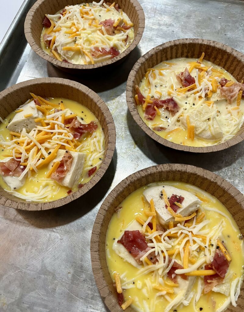 Bacon, Egg, and Cheese Frittata bowls prior to baking.