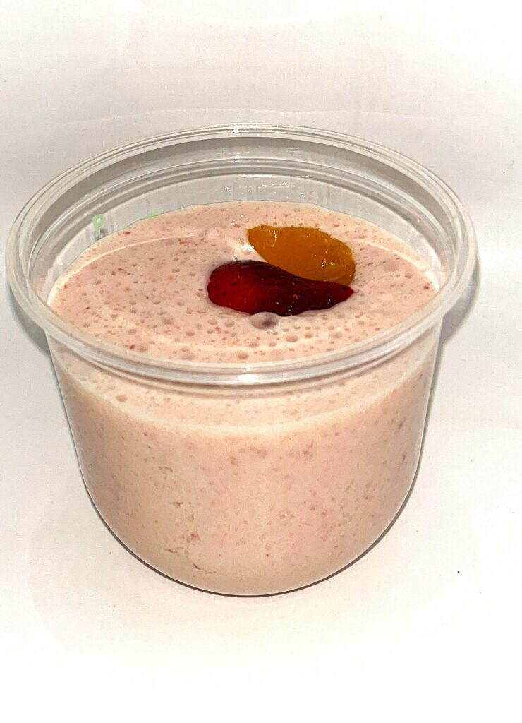 Breakfast smoothie with yogurt, mandarin and strawberries