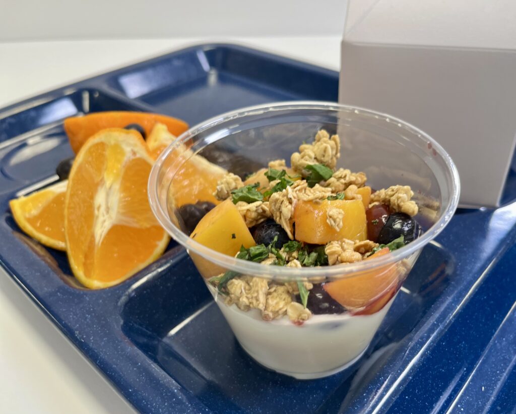 Fruit Trio Parfait with fresh fruit on tray