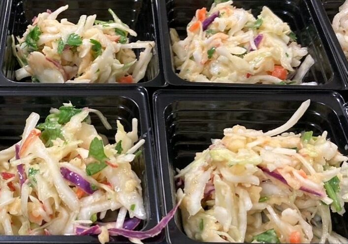 Apple Cilantro Slaw portioned for serving.