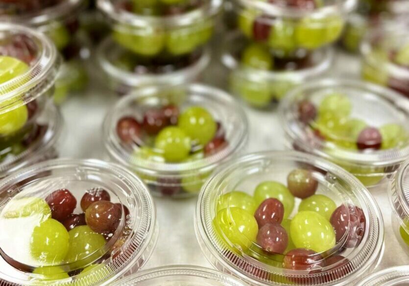 Grapes in clear containers for service.