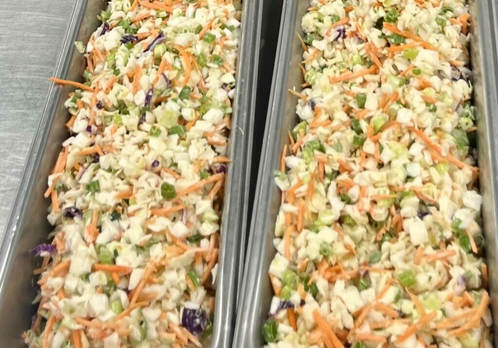 Creamy Cilantro-Lime Slaw in 4-inch pans for service.