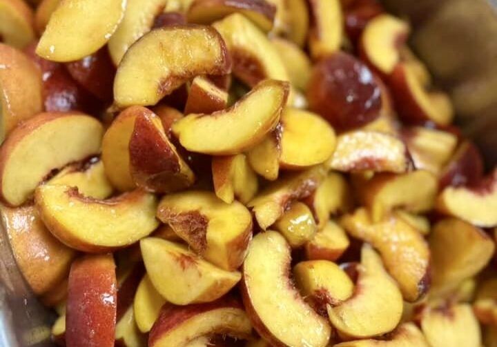 Peaches with Vanilla Honey in 4-inch skinny pans for service.