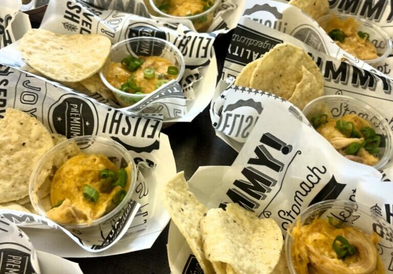 Smoked Buffalo Chicken Dip with chips in baskets.