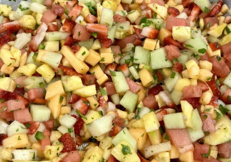 Honey Mint Citrus Dressing on Fruit Salad.